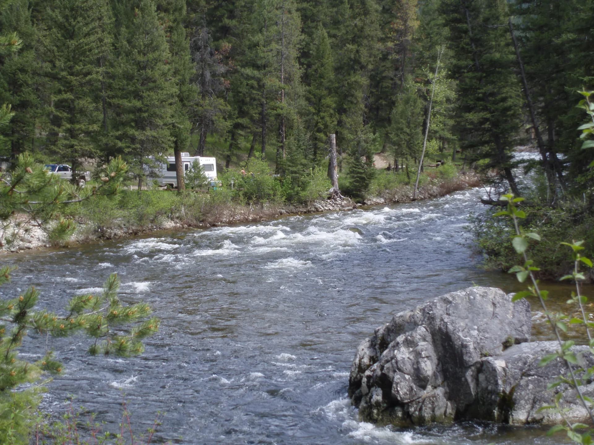 River flowing through forested mountain terrain in Boise National Forest, Idaho