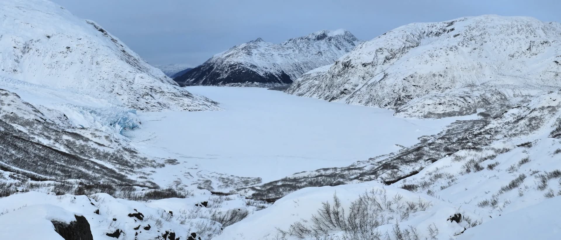 Portage Lake with Portage Glacier and mountain peaks surrounding the glacial blue water, Chugach National Forest, Alaska